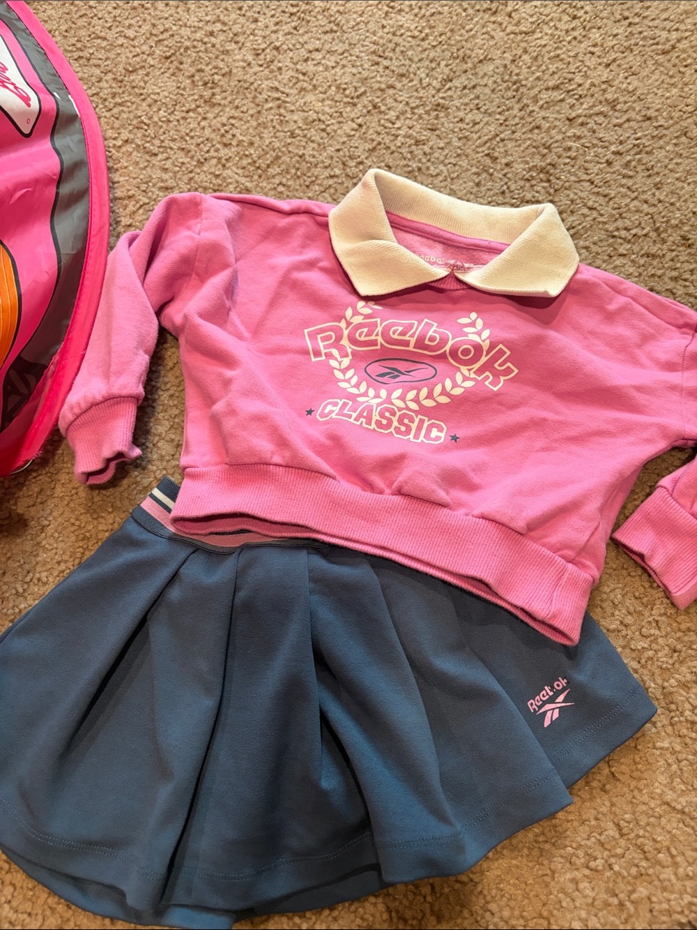 B67 3t Reebok Pink Polo Sweatshirt with Navy Pleated Skirt